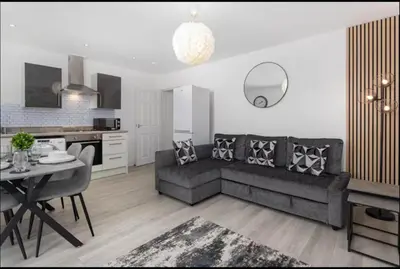 a living room with a couch and a table at #47 Cozy Anfield Near Stadium Free On-Site Parking in Liverpool