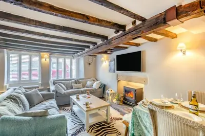 a living room with a couch and a fireplace at 4 Bed in Cartmel oc-d31802 in Cartmel