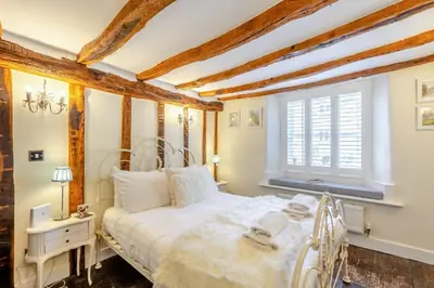 a bedroom with a white bed and a window at 4 Bed in Cartmel oc-d31802 in Cartmel