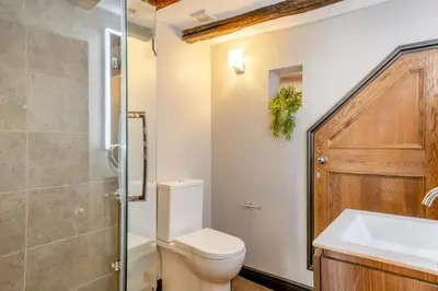 a bathroom with a toilet and a sink and a shower at 4 Bed in Cartmel oc-d31802 in Cartmel