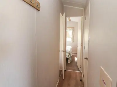 a hallway with a door leading to a bedroom at Barney's Retreat - Docker Park Farm in Carnforth