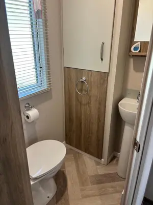 a bathroom with a toilet and a sink at 10 Borwick Lakes, Carnforth - En suite - King size bed in Carnforth