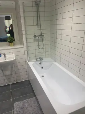 a white bathroom with a tub and a sink at Gorgeous GF 2 Bed 2 bathroom Apartment Liverpool 3 in Liverpool