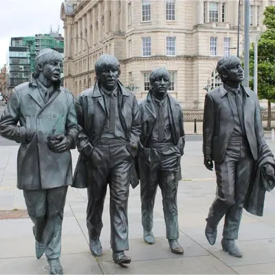 a statue of three men walking in front of a building at Gorgeous GF 2 Bed 2 bathroom Apartment Liverpool 3 in Liverpool