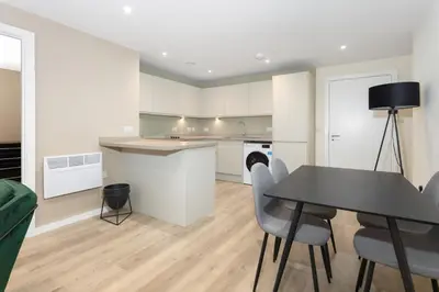 a kitchen and dining room with a table and chairs at Gorgeous GF 2 Bed 2 bathroom Apartment Liverpool 3 in Liverpool