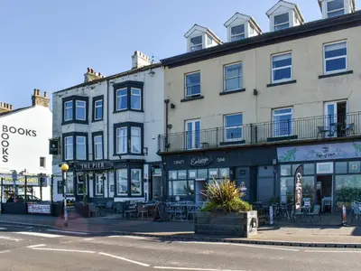 a row of buildings on a city street at Beauty Abounds in Morecambe