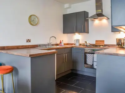 a kitchen with a sink and a counter top at The Croston in Morecambe