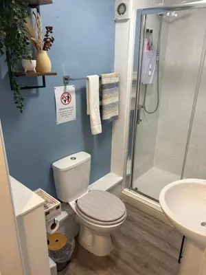 a bathroom with a shower and a toilet and a sink at 1 Double Bedroom Apartment Central Blackpool 4 in Blackpool