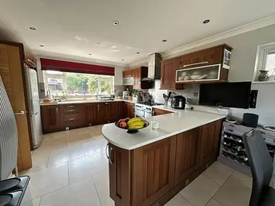a kitchen with a island with bananas on the counter at Birkdale Open - Four Bed Home in Southport