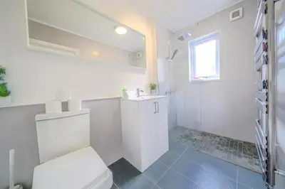 a white bathroom with a toilet and a sink at Stunning 2 Bedroom 6 Guest Flat by Anfield Stadium in Liverpool