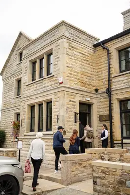 a group of people standing outside of a building at Longridge House in Longridge