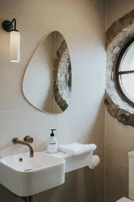 a bathroom with a sink and a mirror at Longridge House in Longridge