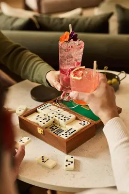 two people holding a drink on a table at Longridge House in Longridge