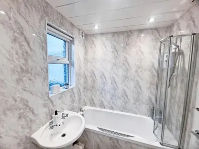 a bathroom with a sink and a shower at 5 star Luxury Home by Liverpool Football Stadium in Liverpool