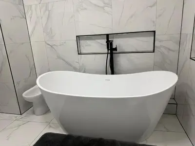 a white bath tub in a bathroom with a toilet at Luxury Double Liverpool City Centre Penthouses 8 Guests in Liverpool