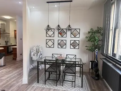 a dining room with a glass table and chairs at Luxury Double Liverpool City Centre Penthouses 8 Guests in Liverpool