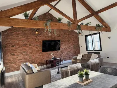 a living room with a brick wall at Luxury Double Liverpool City Centre Penthouses 8 Guests in Liverpool