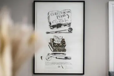 a framed drawing of tools on a wall at Two Apartments in One , City Centre, Sleeps 11! in Liverpool