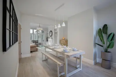 a dining room with a table and a potted plant at Blackpool Beauty! - Full House - Sleeps 9 in Blackpool