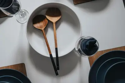 two wooden spoons on a plate on a table at Anfield Abode in Liverpool