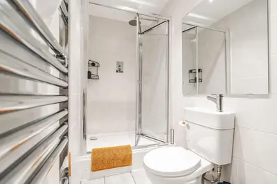 a bathroom with a toilet and a shower at Anfield Abode in Liverpool