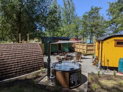 a backyard with a bbq and a tent at The Southworth Spa at Samlesbury Hall in Samlesbury