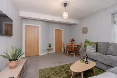 a living room with a couch and a table at Parson Castle View, Sleeps 6, Clitheroe Centre in Clitheroe