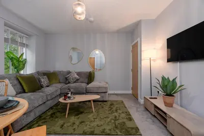 a living room with a couch and a tv at Parson Castle View, Sleeps 6, Clitheroe Centre in Clitheroe