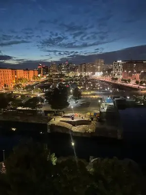 a view of a city at night with lights at Liverpool City Centre Apartment with view in Liverpool