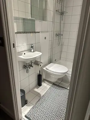 a bathroom with a toilet and a sink at Liverpool City Centre Apartment with view in Liverpool