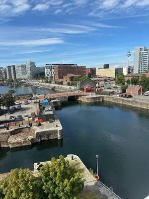 a river with a bridge in a city at Liverpool City Centre Apartment with view in Liverpool