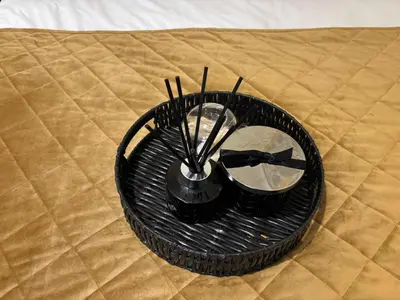 a black basket with forks and a mirror on a bed at Affordable Golden Mile Hotel In Blackpool Close To The Beach And Blackpool City Centre With Free Street Parking Subject To Availabilty in Blackpool