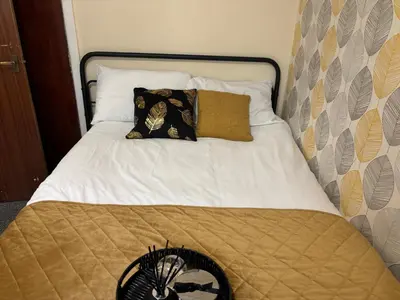a bed with two pillows on top of it at Affordable Golden Mile Hotel In Blackpool Close To The Beach And Blackpool City Centre With Free Street Parking Subject To Availabilty in Blackpool