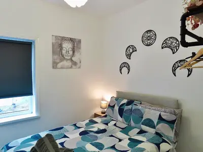 a bedroom with a bed and a window at Central Location 1 Double Bedroom Apartment 7 in Blackpool