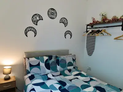 a bedroom with a bed with black and white pillows at Central Location 1 Double Bedroom Apartment 7 in Blackpool