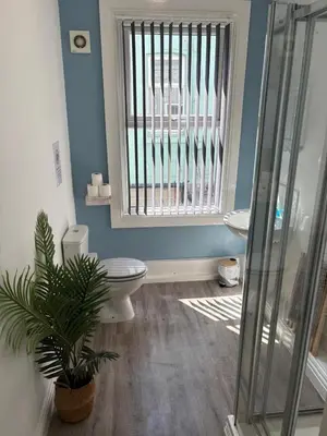a bathroom with a toilet and a window at Central Location 1 Double Bedroom Apartment 7 in Blackpool