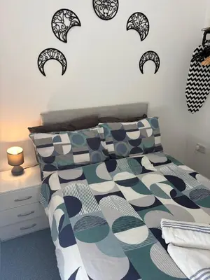 a bedroom with a bed with black and white pillows at Central Location 1 Double Bedroom Apartment 7 in Blackpool
