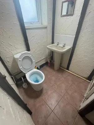 a bathroom with a toilet and a sink at Ground Floor Cute & Cozy - 1 Person Studio - South Pier in Blackpool