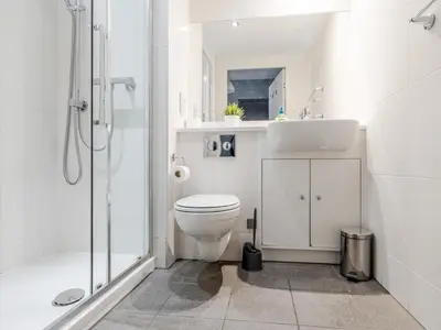a bathroom with a toilet and a sink and a shower at Pass the Keys Stylish Flat Near Moorfields Stn in Liverpool
