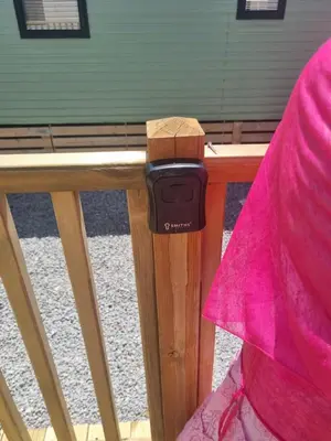 a apple watch sitting on top of a wooden fence at Leafy Lytham Holiday Home in Warton