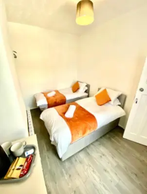 two beds in a small room with at stay anfield in Liverpool