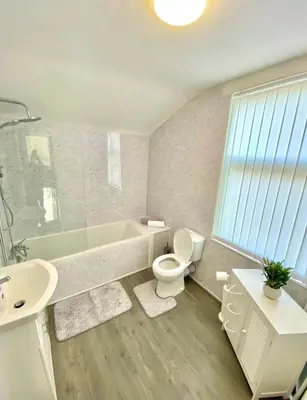 a bathroom with a tub and a toilet and a sink at stay anfield in Liverpool