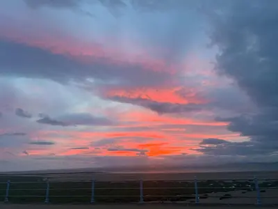 a cloudy sky with a sunset in the sky at Nettle Cottage in Heysham