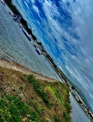 a view of a beach with boats in the water at Lake District Caravan Holiday in Millom