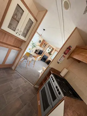an overhead view of a kitchen with a stove at Lake District Caravan Holiday in Millom