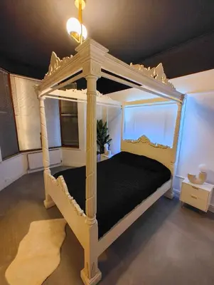 a bedroom with a canopy bed in a room at Casa Rocío in Liverpool