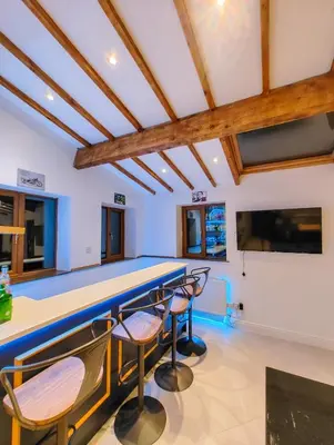 a room with a ping pong table and chairs at Casa Rocío in Liverpool