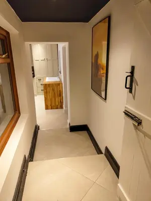 a hallway of a home with white walls at Casa Rocío in Liverpool