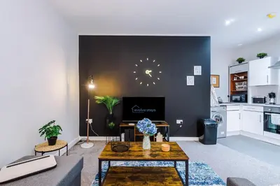a living room with a couch and a table at Pool Table, Stunning 2Bed Apt, Central Location in Liverpool