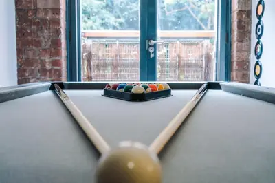 a billiard table with a cue and balls on it at Pool Table, Stunning 2Bed Apt, Central Location in Liverpool